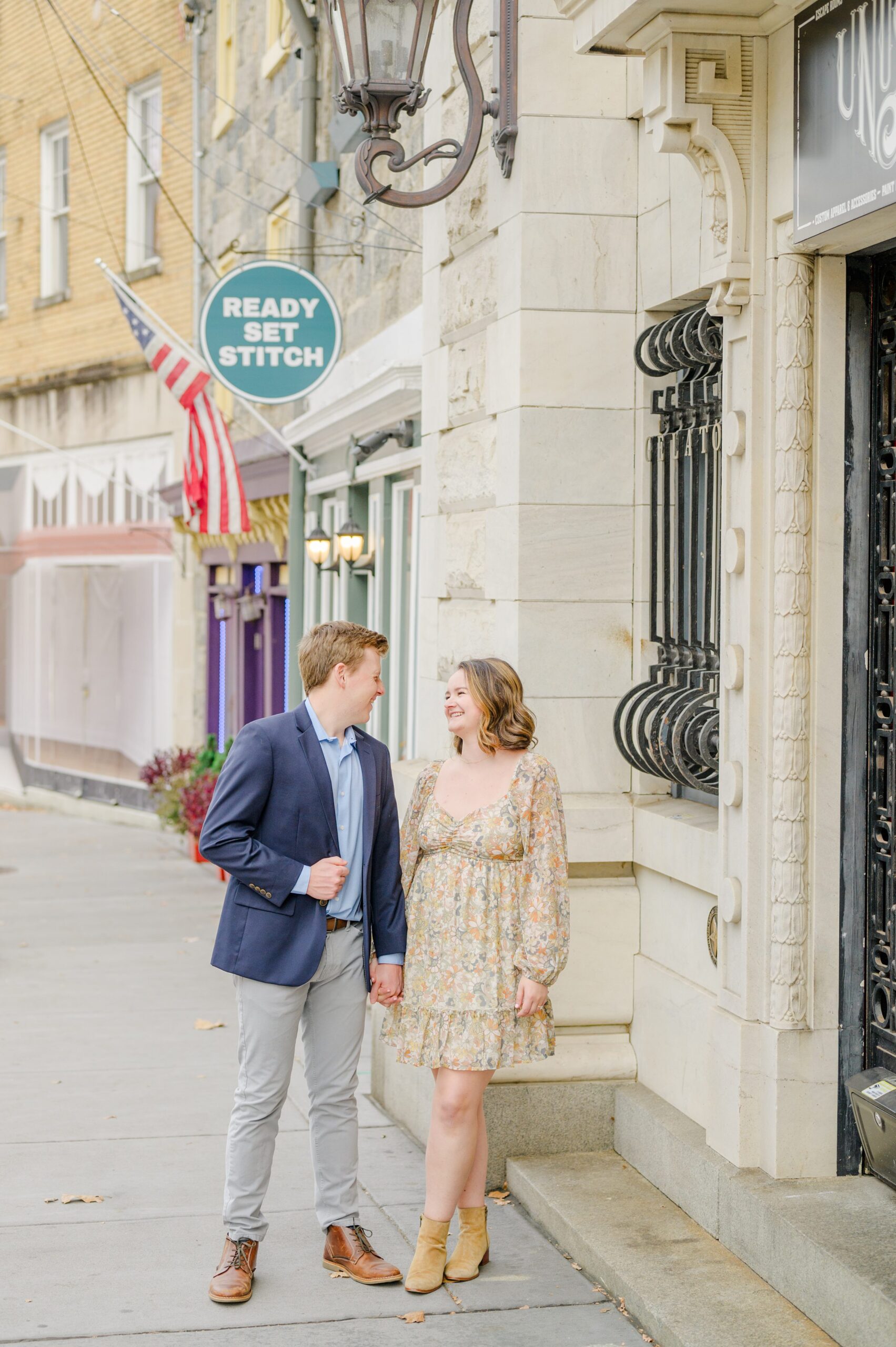 Engaged couple at the Historic Old Ellicott City near Baltimore, Maryland for engagement photos photographed by Baltimore Wedding Photographer Cait Kramer Photography