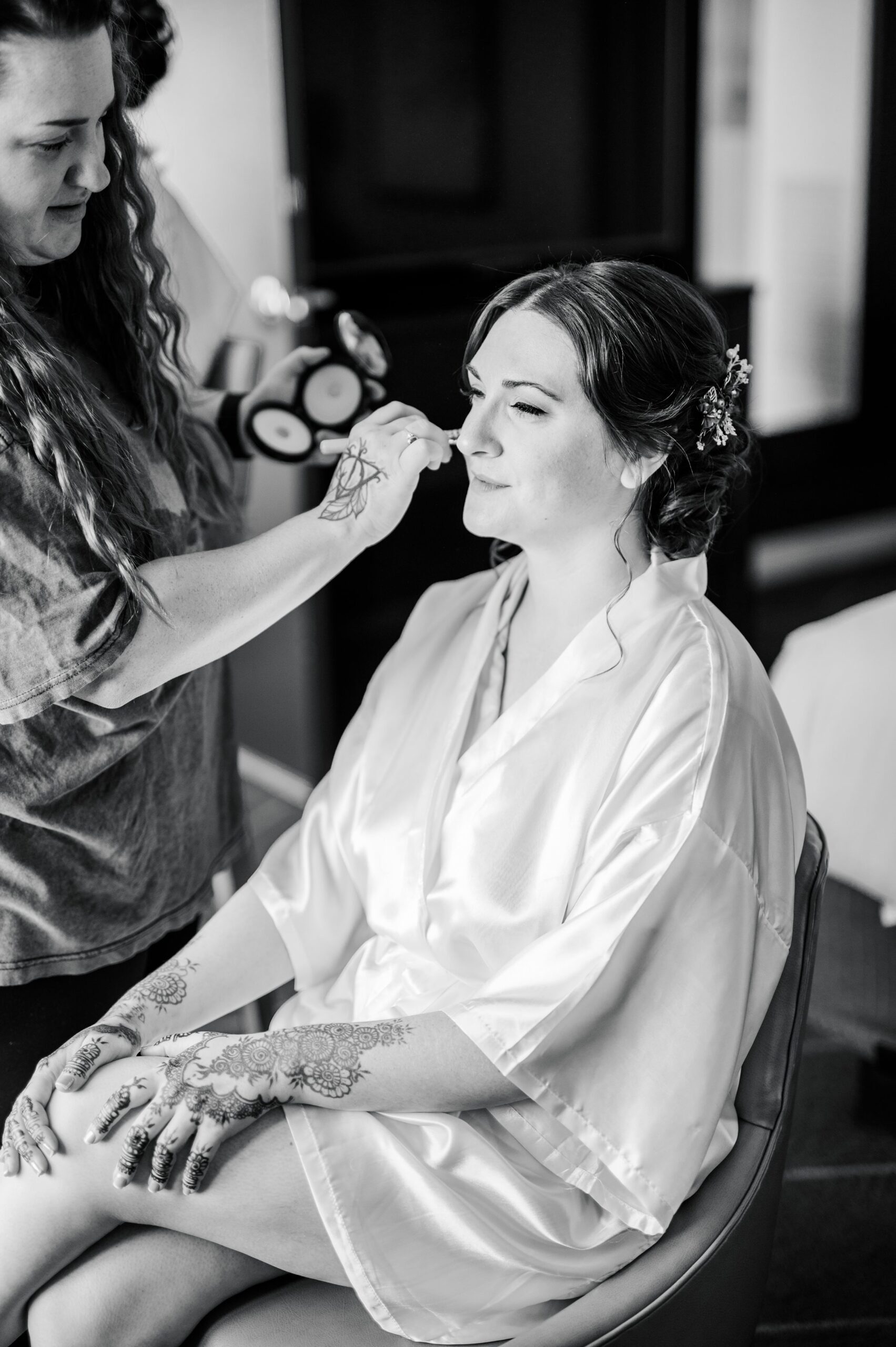 Bride getting her hair and makeup done